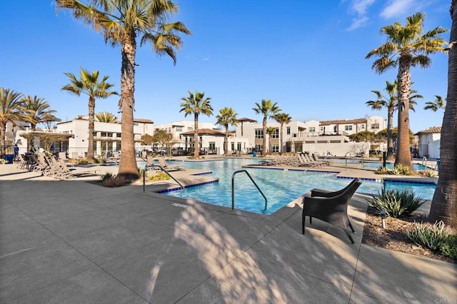 view of swimming pool with a patio