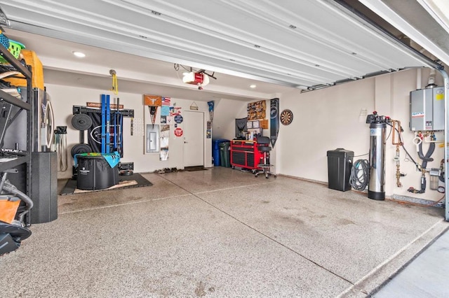 garage with a garage door opener and water heater