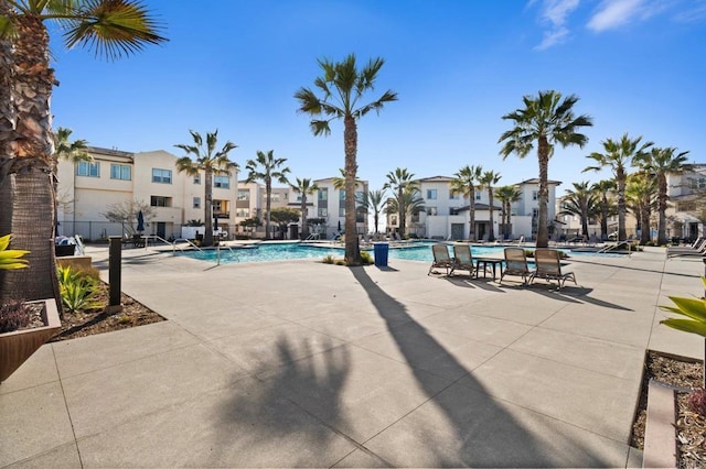 view of swimming pool featuring a patio area