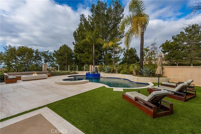 view of property's community featuring an outdoor living space with a fire pit, a pool with hot tub, a patio area, and a lawn