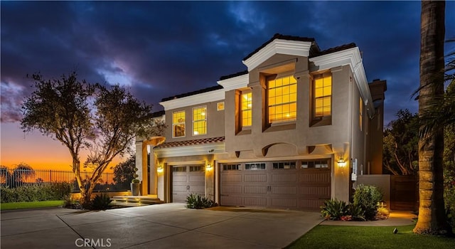 view of front of property with a garage