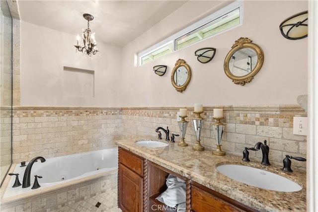 bathroom with vanity and tiled bath