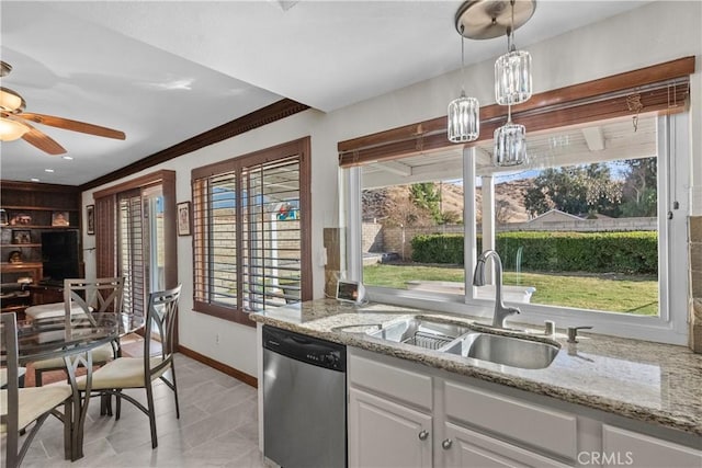 kitchen with light stone countertops, dishwasher, white cabinets, sink, and pendant lighting