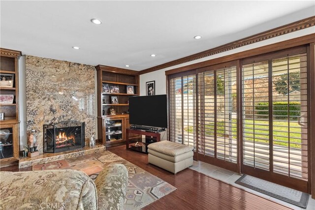 20566 Alaminos Dr, Saugus, CA 91350 - living room with a high end fireplace, recessed lighting, wood finished floors, crown molding, and built in features