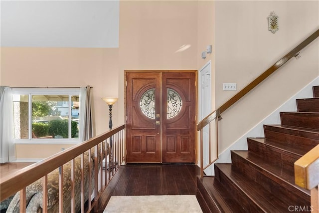 20566 Alaminos Dr, Saugus, CA 91350 - entrance foyer with a high ceiling, dark wood-type flooring, and stairway