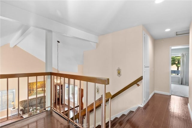 hall featuring hardwood / wood-style flooring and vaulted ceiling with beams