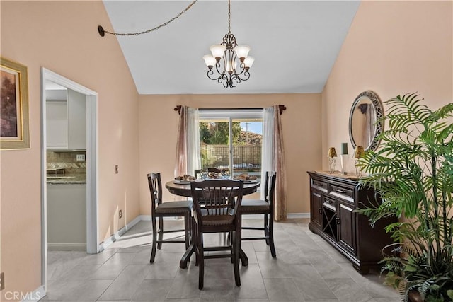 20566 Alaminos Dr, Saugus, CA 91350 - dining room featuring a chandelier, lofted ceiling, and baseboards