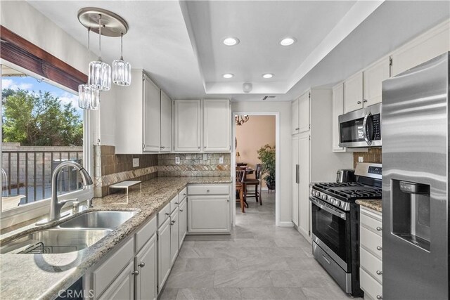 20566 Alaminos Dr, Saugus, CA 91350 - kitchen with stainless steel appliances, a chandelier, recessed lighting, backsplash, and a sink