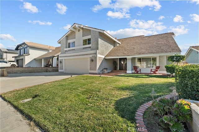 front facade with a porch, a garage, and a front yard