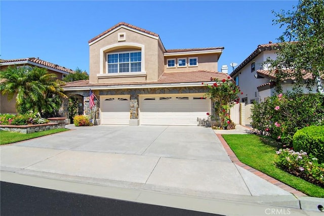 mediterranean / spanish house featuring a garage