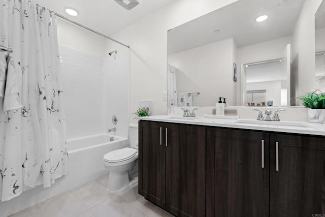 full bathroom featuring vanity, toilet, tile patterned floors, and shower / tub combo with curtain