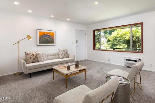 living room featuring a wall unit AC and carpet