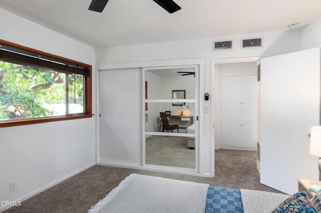 unfurnished bedroom featuring carpet flooring, a closet, and ceiling fan