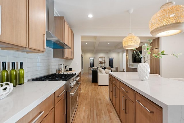 kitchen featuring wall chimney exhaust hood, coffered ceiling, beamed ceiling, light hardwood / wood-style floors, and high end stove