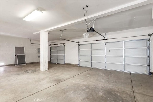 garage featuring a garage door opener