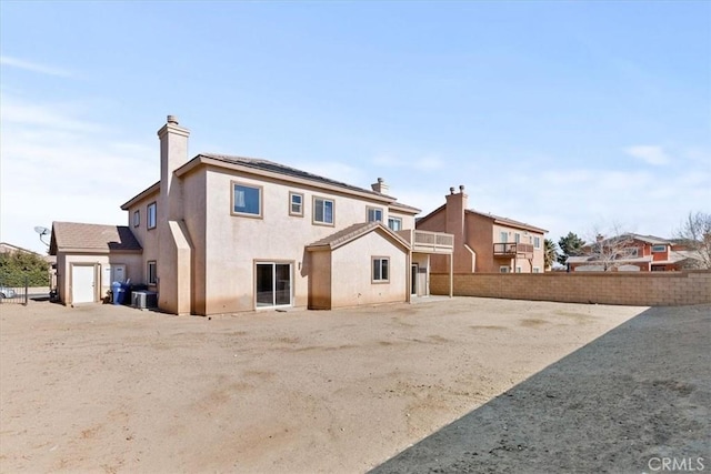 rear view of house featuring central AC unit