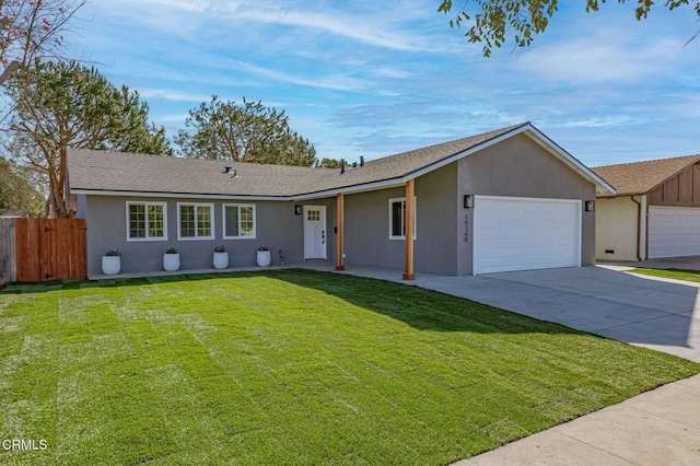 single story home featuring a garage and a front yard