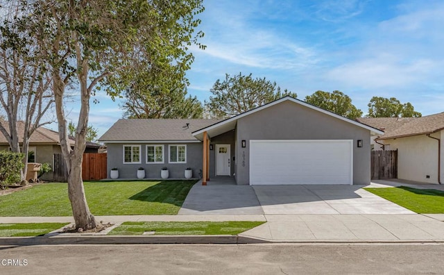 ranch-style house featuring a garage and a front lawn