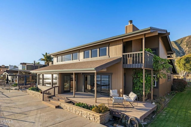 rear view of house featuring a patio