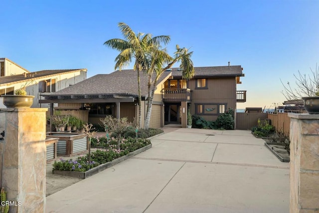 view of front of home featuring a balcony