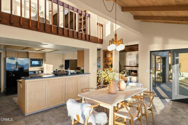 dining room with high vaulted ceiling, wooden ceiling, a notable chandelier, and beamed ceiling