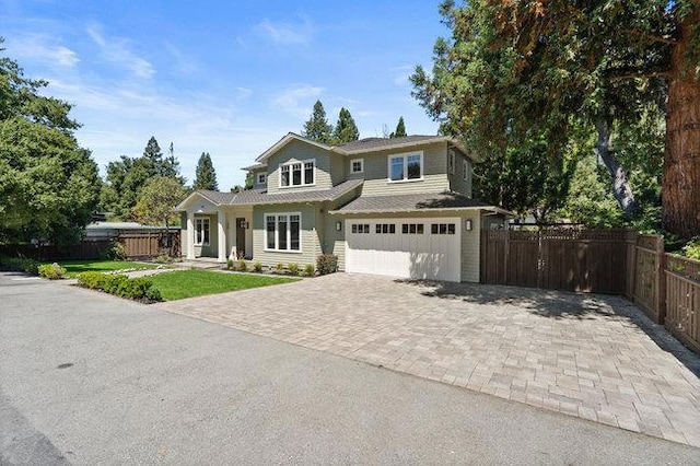 view of front facade featuring a garage and a front yard