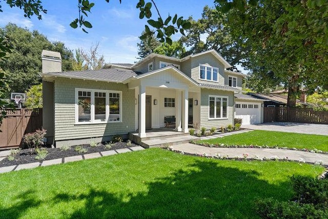 view of front of property with a garage and a front yard