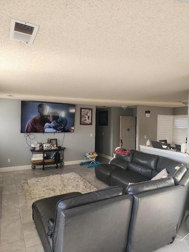 living room featuring a textured ceiling