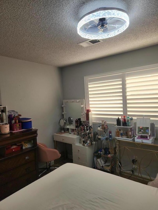 bedroom featuring a textured ceiling