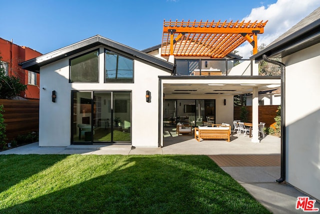 back of property with a pergola, a yard, and a patio area