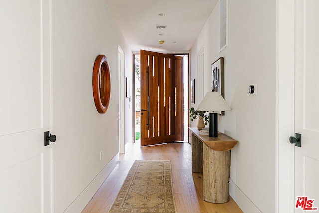 hallway featuring light hardwood / wood-style floors