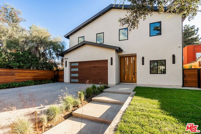 modern home with a garage and a front yard