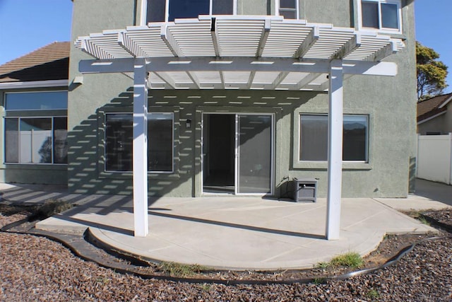 rear view of property featuring a patio area and a pergola