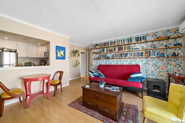 living room with light hardwood / wood-style floors and ornamental molding