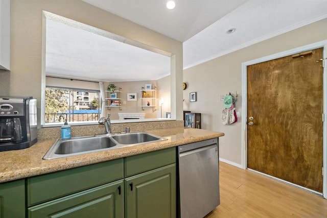 kitchen featuring light hardwood / wood-style flooring, dishwasher, sink, ornamental molding, and green cabinetry