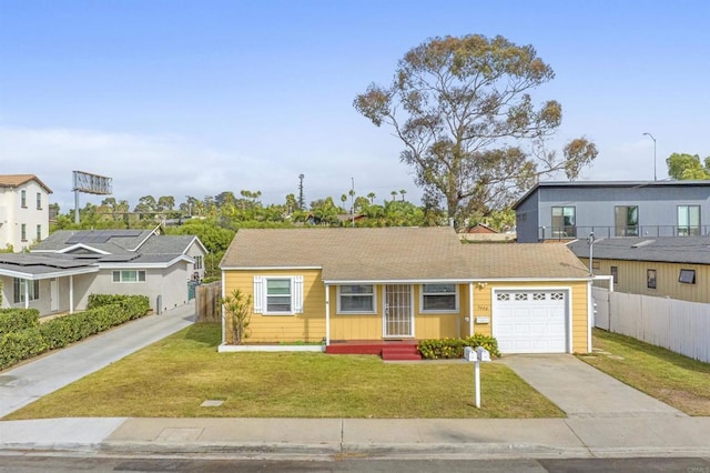 view of front of home featuring a garage and a front yard