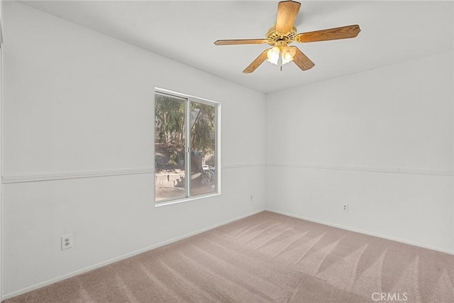 unfurnished room featuring ceiling fan and carpet flooring