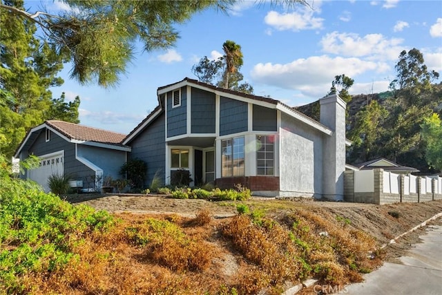 view of front of property with a garage