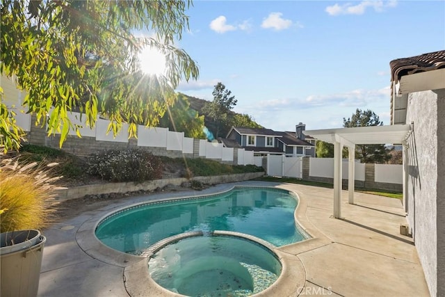 view of pool with an in ground hot tub, a patio, and a pergola