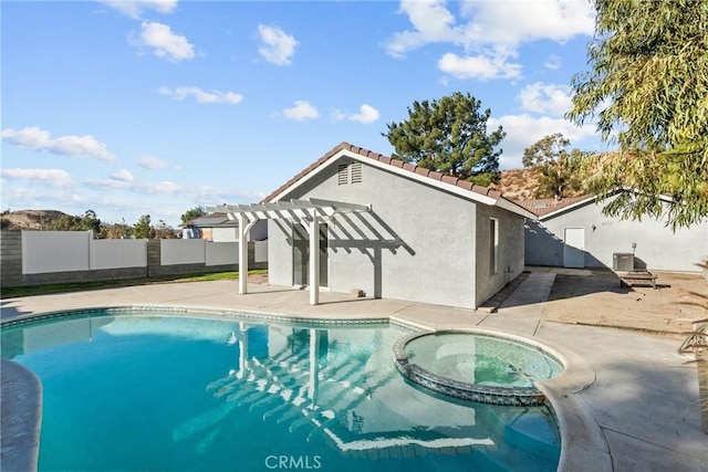 view of swimming pool with an in ground hot tub, a patio, and a pergola