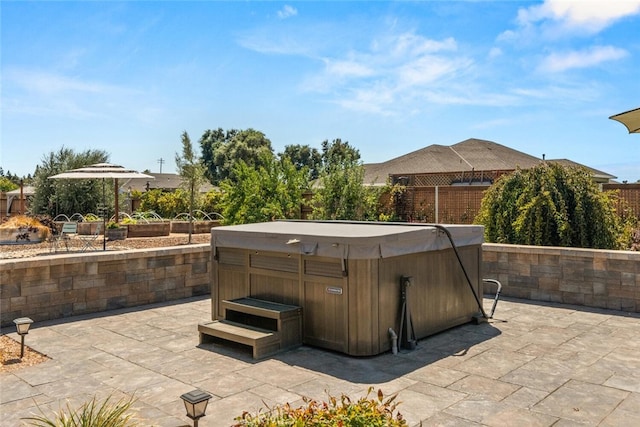 view of patio with a hot tub