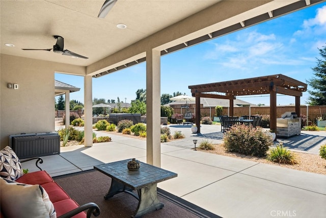 view of patio / terrace with ceiling fan, area for grilling, and a pergola