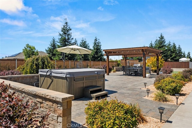 view of patio / terrace with a pergola and a hot tub