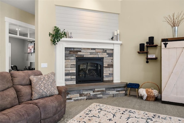 living room featuring carpet floors and a fireplace