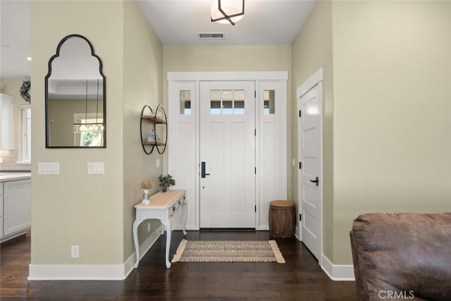 entrance foyer with dark hardwood / wood-style floors