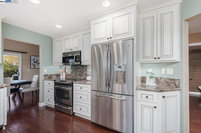 kitchen featuring white cabinetry, stainless steel appliances, dark hardwood / wood-style floors, and light stone countertops