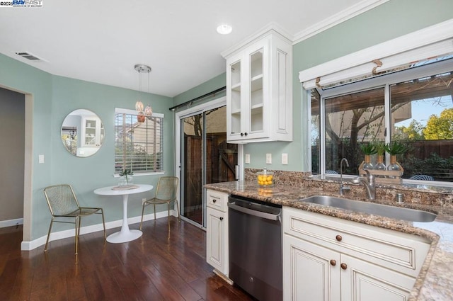 kitchen featuring dark wood-type flooring, sink, decorative light fixtures, dishwasher, and white cabinets