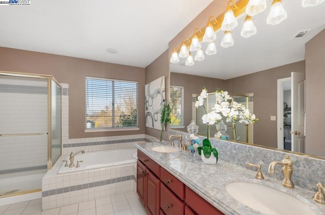 bathroom featuring vanity, tile patterned floors, and shower with separate bathtub