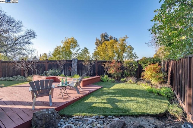 view of yard with a deck