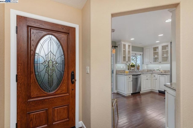 foyer entrance with dark hardwood / wood-style flooring